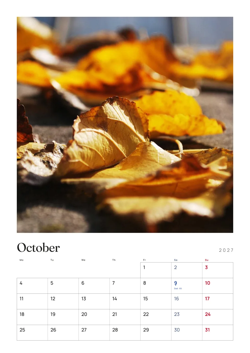 An A3 calendar page for October 2027: autumn leaves above the month grid.